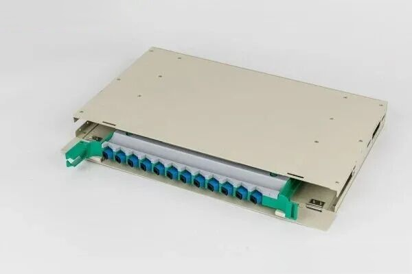 Drawer-type optical distribution frame unit box with lid open, showing splice trays and cable management inside