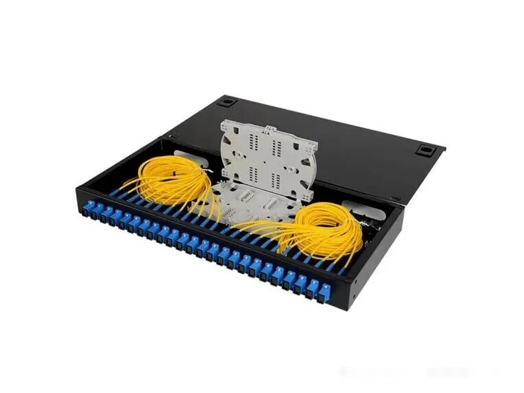 Fiber optic splice tray with coiled pigtails showing correct slack storage and bend radius inside an ODF